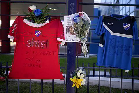 Juan Izquierdo: A photo of Uruguayan soccer player Juan Izquierdo, flowers and jerseys hang outside the Nacional soccer club in Montevideo